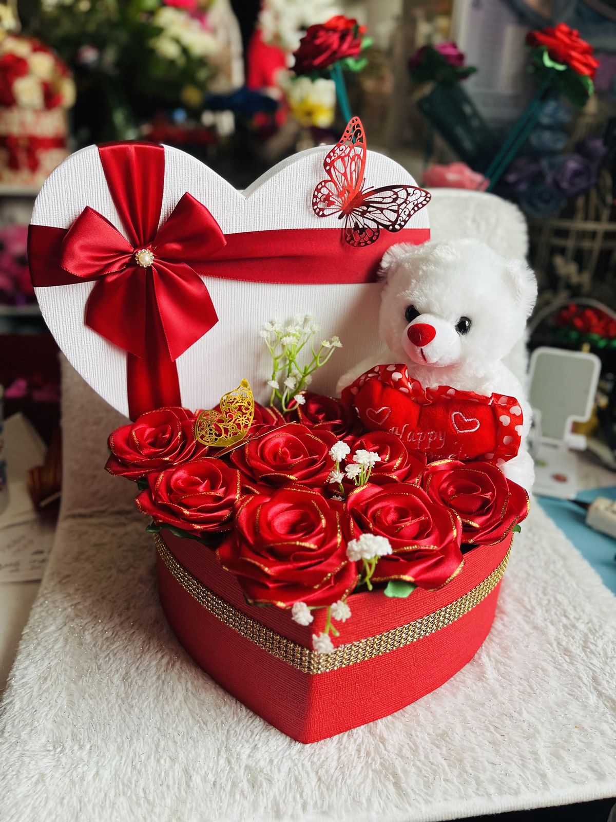 Red heart box with silk roses, white teddy bear and butterfly decoration