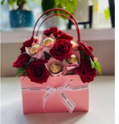 Pink handbag gift box with red roses and Ferrero Rocher chocolates