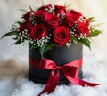 Mini caja redonda negra con rosas rojas y lazo rojo