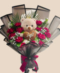 Ramo de rosas rojas y fucsia con osito de peluche con corona y corazón Love You en papel gris
