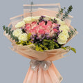 Luxury bouquet of white and pink roses with limonium and eucalyptus in beige wrap