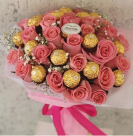 Pink roses and Ferrero Rocher chocolates bouquet wrapped in pink paper